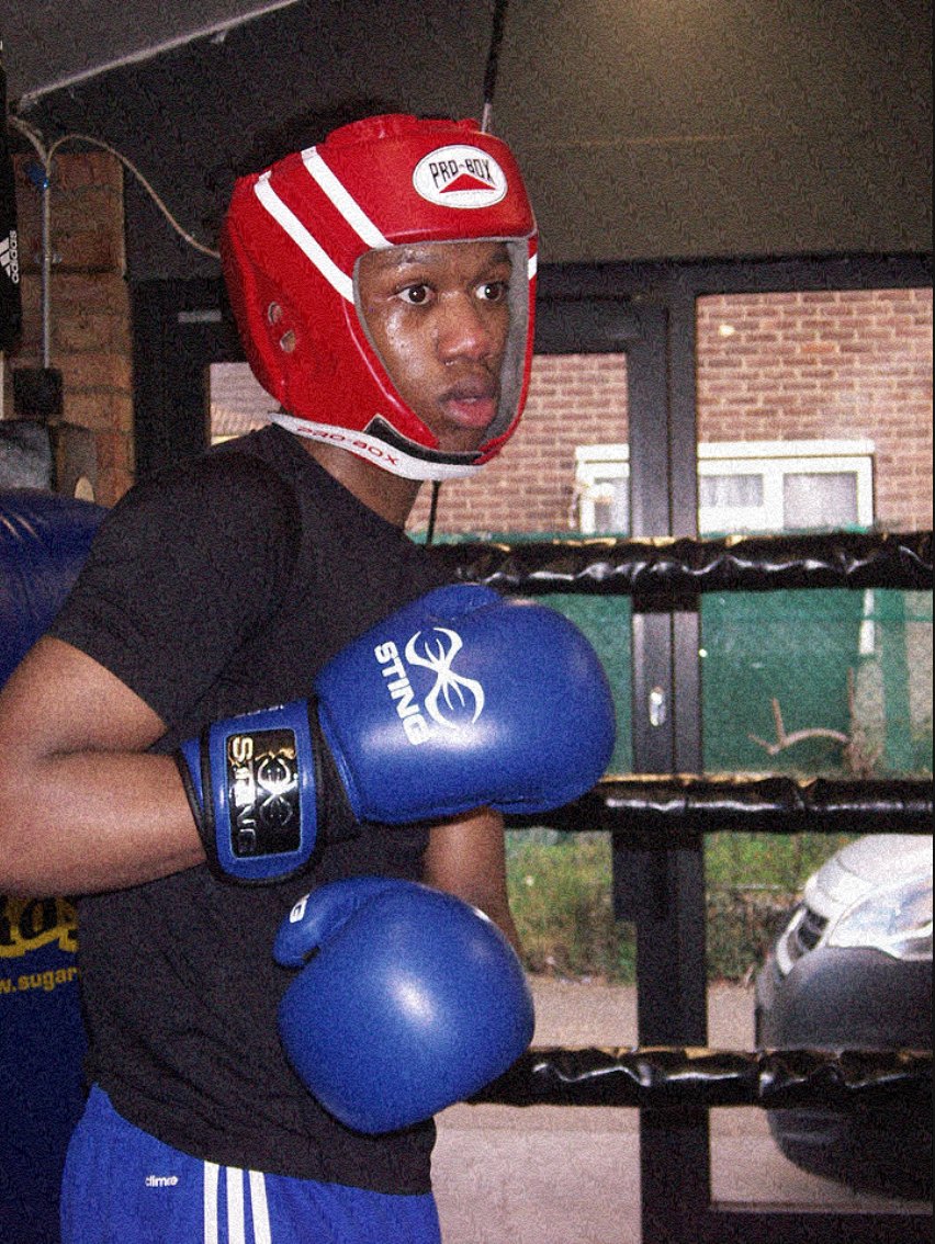 In the ring, squared up, red headguard