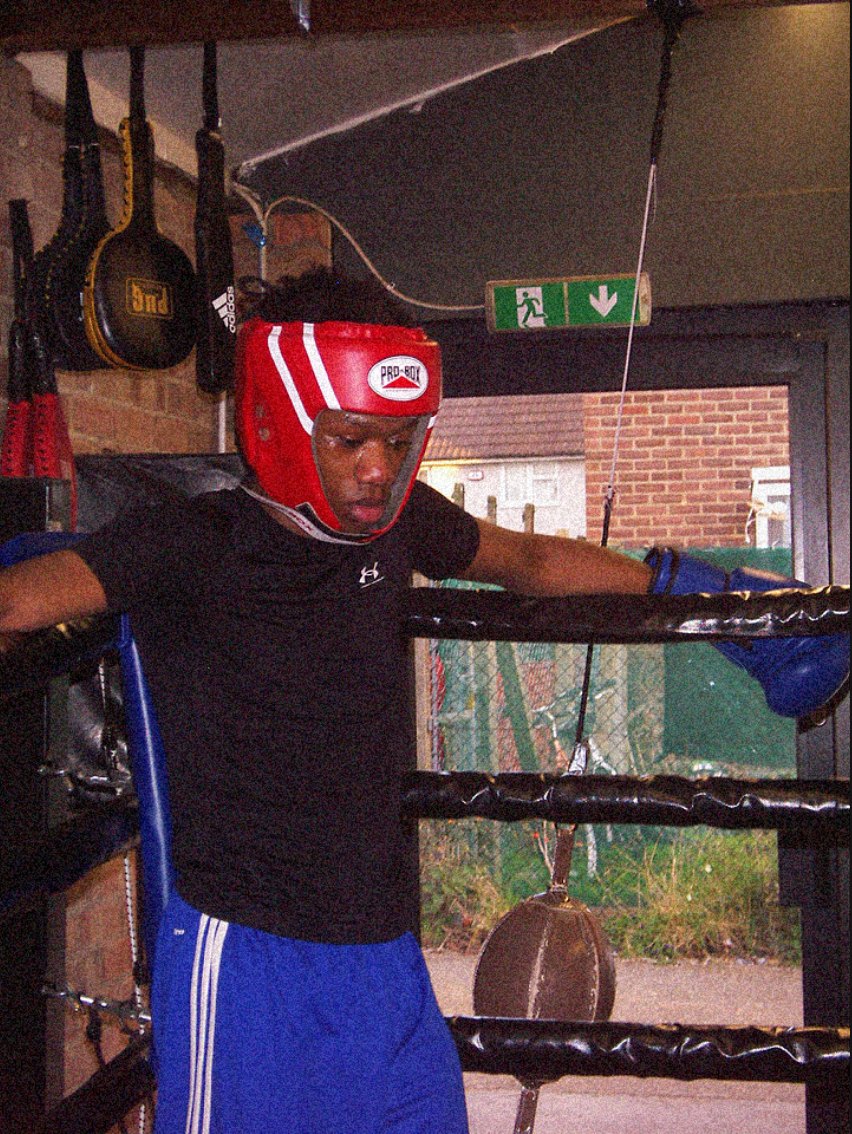 Jude Helder in the ring, headguard and gloves